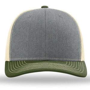 The Richardson 112 Snapback Trucker Cap by Richardson is a custom leather patch hat featuring a grey and green design with beige polyester mesh back and sides. It boasts white stitching on the brim and an adjustable snapback for a perfect fit.