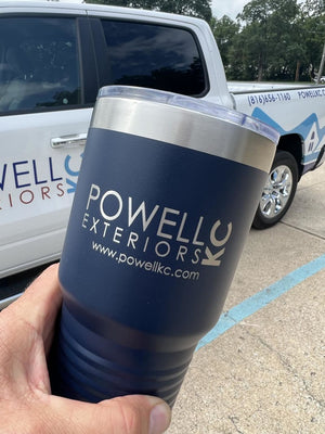 A hand holds a blue drink tumbler with "Powell Exteriors" printed on it in front of a parked Powell Exteriors company truck, showcasing their Custom Tumblers 20 oz with your Logo or Design Engraved - Special Bulk Wholesale Pricing - Pack of 96 Pieces - 1 Color - $12.49 Each by Kodiak Coolers.