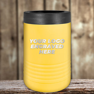 A yellow Kodiak Coolers tumbler with a black lid sits on a wooden surface, featuring "Your Logo Engraved Here." This laser-etched design makes an ideal corporate promotional gift, merging style with functionality.