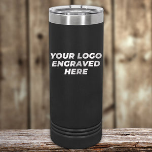 A black Kodiak Coolers tumbler featuring "Your Logo Engraved Here" on its steel lid rests on wood, ideal for promotional gifts. The sleek design of this Custom Tumbler with Laser Etched Design adds elegance against the blurred wooden background, with no setup fees and a limited time offer.