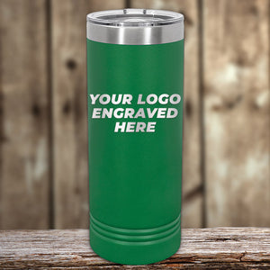 The green custom tumbler by Kodiak Coolers, featuring a laser etched "Your Logo Engraved Here," is ideal for corporate gifts. Elegantly showcased on wood with a blurred background, it highlights the sleek design. Enjoy no setup fees and make the most of this limited time offer!.