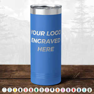 A tall tumbler in blue featuring the text "Your Logo Engraved Here," perfect for personalization or as a promotional gift. Part of the Kodiak Coolers BLACK FRIDAY SALE, this custom drinkware includes a one-side logo engraving at no setup fee and is available in various colors with a minimal order of $250.