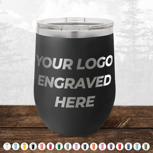 Kodiak Coolers 4th of July SALE - Engraved Custom Logo Drinkware - Front Engraved Logo Included - $250 Minimal Order with the words "YOUR LOGO ENGRAVED HERE" on a wooden surface, featuring various color options at the bottom of the image—perfect for personalized mugs or promotional gifts.