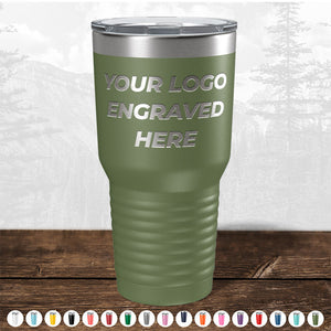 A green tumbler from Kodiak Coolers, featuring the text "Your Logo Engraved Here," rests on a wooden surface. Various color options are displayed at the bottom, making this custom drinkware a perfect promotional gift. Don't miss out on our HUGE LABOR DAY SALE - ENDS TODAY!