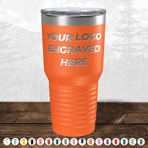 An orange insulated tumbler from Kodiak Coolers, customized with "Your Logo Engraved Here" text. Below it, various other personalized mugs in different colors are showcased. The background features a faded nature scene, making this promotional gift ideal for any occasion. Don't miss the HUGE LABOR DAY SALE - ENDS TODAY!