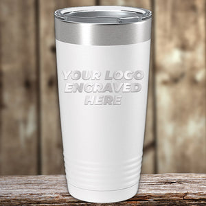 A Kodiak Coolers Custom Tumblers 20 oz with your Logo or Design Engraved - Special Bulk Wholesale Pricing - Bundle Packs is placed on a wooden surface with a wooden backdrop, making it an ideal choice for custom tumblers available at wholesale pricing.