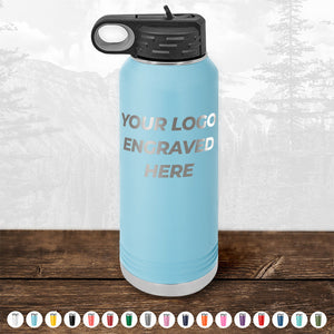 A sturdy, blue insulated water bottle with a black lid from Kodiak Coolers is shown with the text "YOUR LOGO ENGRAVED HERE." Various color options are displayed at the bottom of the image, making it an ideal promotional gift. Don't miss out on the HUGE LABOR DAY SALE - ENDS TODAY for this Custom Drinkware Engraved with your Logo or Design - Front Side Logo Included!