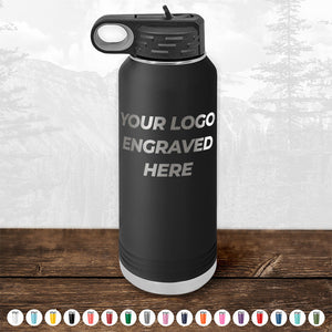 A black water bottle with the text "YOUR LOGO ENGRAVED HERE" displayed on its side, perfect as a promotional gift. The image also showcases various color options at the bottom, similar to what you'd find with custom mugs. This Custom Drinkware Engraved with Your Logo or Design from Kodiak Coolers includes a front side logo and is currently available at a HUGE LABOR DAY SALE - ENDS TODAY!