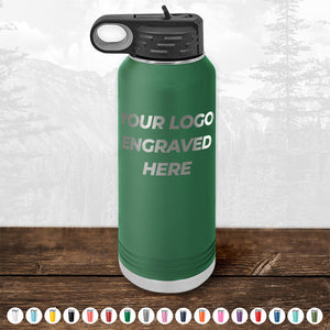 A green water bottle with a black cap from Kodiak Coolers, featuring the words "YOUR LOGO ENGRAVED HERE" on the front. This personalized drinkware is an ideal promotional gift. Available in various colors as shown below. Don't miss our HUGE LABOR DAY SALE - ENDS TODAY!