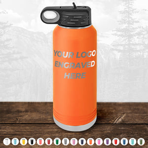 Kodiak Coolers Custom Drinkware, featuring an orange water bottle with a black lid and the text "YOUR LOGO ENGRAVED HERE" on the front side. Various color options are shown at the bottom. Ideal as personalized drinkware or a promotional gift. Background depicts a mountain landscape. Don't miss our HUGE LABOR DAY SALE - ENDS TODAY!