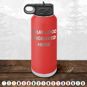 Kodiak Coolers' Custom Drinkware, engraved with your logo or design on the front side, features a red insulated water bottle with a black lid. This personalized drinkware is part of our HUGE LABOR DAY SALE - ENDS TODAY! Available in various color options, they are showcased below the bottle on a wooden surface against a mountain background.