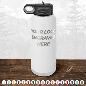 A Kodiak Coolers white insulated water bottle with a black lid sits on a wooden surface. The bottle's label reads "Custom Drinkware Engraved with your Logo or Design - Front Side Logo Included." This personalized drinkware makes for an excellent promotional gift, and multiple color options are displayed below the bottle. Don't miss out on the HUGE LABOR DAY SALE, which ends today!