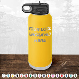 Yellow insulated water bottle from Kodiak Coolers with a black lid, featuring the text "YOUR LOGO ENGRAVED HERE." Displayed outdoors against a nature background, this personalized drinkware is ideal for promotional gifts. Various color options are available. Don't miss out on the HUGE LABOR DAY SALE - ENDS TODAY!