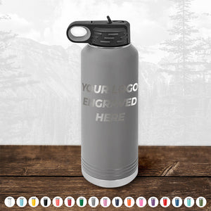 Kodiak Coolers Custom Water Bottles 40 oz with your Logo or Design Engraved - Low 6 Piece Order Minimal Sample Volume placed on a wooden surface.