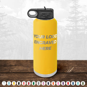 Yellow insulated Kodiak Coolers water bottle with a customizable logo space, perfect for promotional items, displayed on a wooden surface against a blurred background.