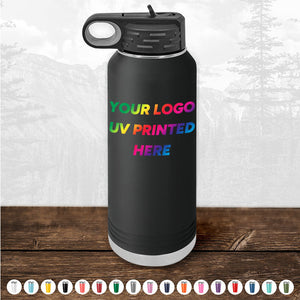 The black insulated water bottle, branded by Kodiak Coolers, can be customized with your logo or design using UV printing in vibrant rainbow colors. Ideal for corporate promotional gifts, this item showcases an array of color options at the bottom, all set against a beautiful mountain landscape background. Limited time offer with a minimal order of $250.