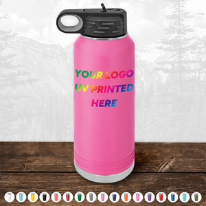 A pink Kodiak Coolers insulated water bottle features a black lid and offers customizable UV printing. The placeholder text, "Your logo UV printed here," highlights its personalization options. Available in various colors, this item is perfect for corporate promotional gifts or bulk wholesale purchases of custom tumblers. Don't miss out on the limited-time offer with a minimal order of $250!