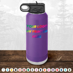 A customizable purple tumbler from Kodiak Coolers, featuring the text "Your Logo UV Printed Here," placed on a wooden surface against a mountain landscape backdrop. Perfect as a corporate promotional gift with various color options available and minimal order of $250 for a limited time.