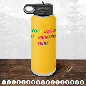 Bright yellow insulated water bottle with a sleek black lid, uniquely customizable with UV-printed text, set against a backdrop of assorted colored bottles and a faint mountainous landscape. This makes it an ideal corporate promotional gift from Kodiak Coolers. Take advantage of our limited-time offer on bulk wholesale pricing for these custom tumblers; minimal order is $250.