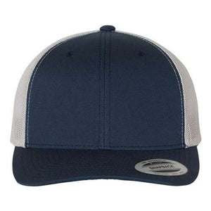 The YP Classics Yupoong Classics Six-Panel Retro Trucker Snapback Hat 6606 is a navy and white cap with a camo mesh back and a curved brim, featuring a front sticker. It is designed with a snapback closure for easy adjustment and comfort.